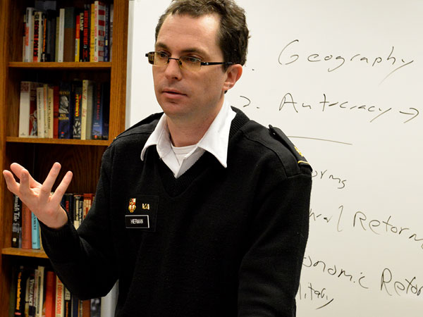 Image of Maj. Brent Hierman in front of white board