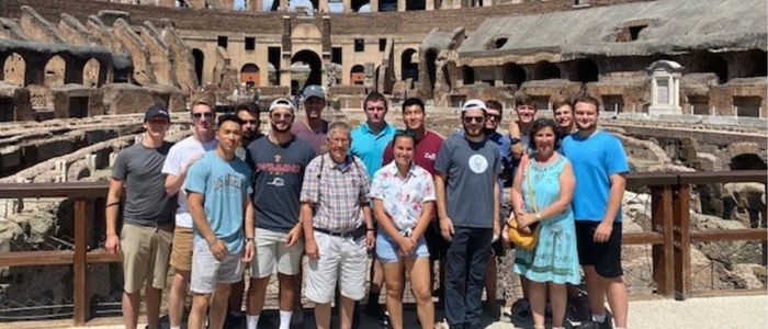Students and professors at the Colesseum in Rome during study abroad engineering program with VMI.