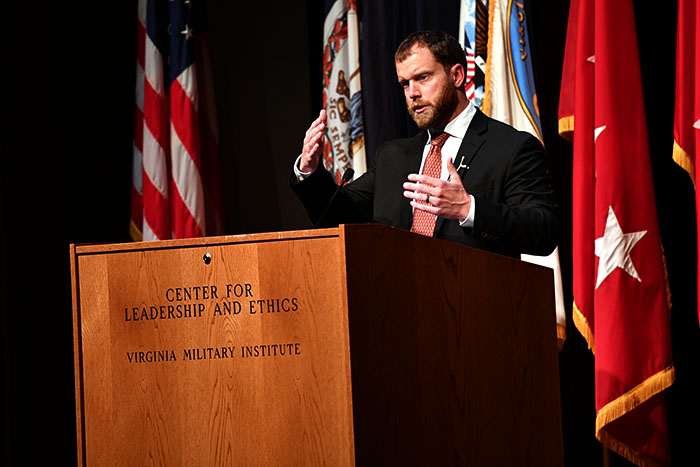 A man stands at a podium