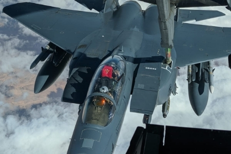 Close up of graduate holding VMI flag during refuel - Courtesy of Lt Col Roderick James '04 and Lt Col Derek Rankin '05