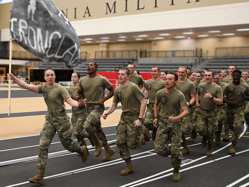 VMI cadets carry flag and run on track during rat olympics