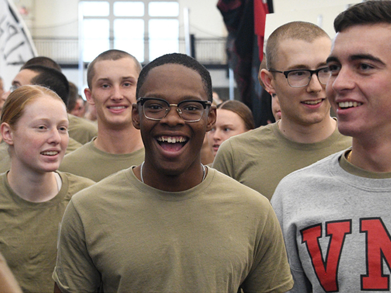 VMI cadets walking close together in group in gym and smiling during rat olympics