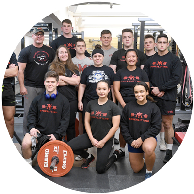 Powerlifting Club cadet members in weight room group photo circle