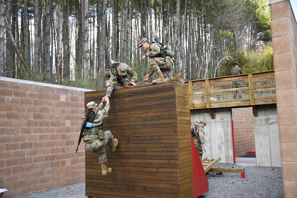 Spring FTX Marines working to climb wall