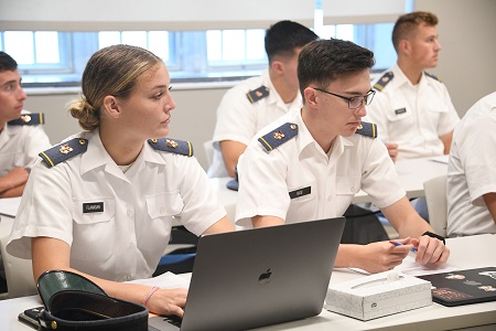 VMI cadets sit in a classroom.