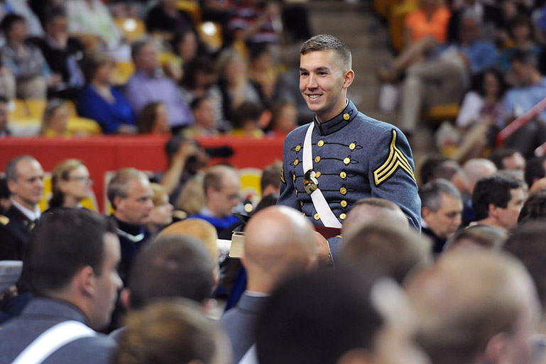 Ben Cross smiles after receiving his diploma in May 2013.