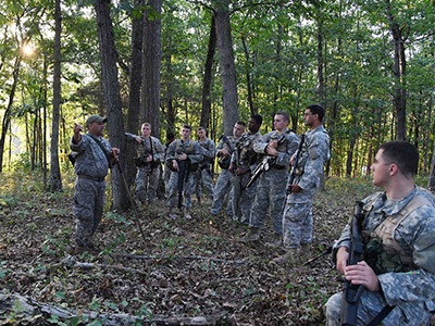 Sgt. 1st Class Carmelo Echevarria gives instructions before the night ambush begins.