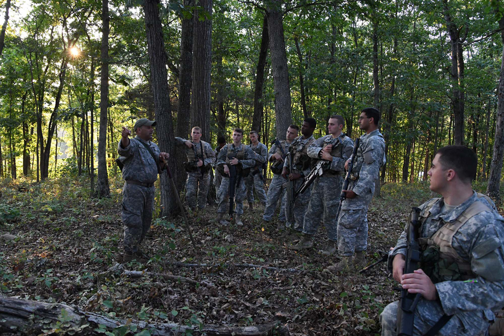 Sgt. 1st Class Carmelo Echevarria gives instructions before the night ambush begins.