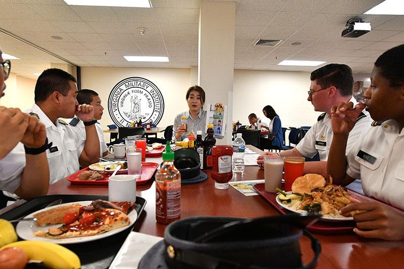 Dr. Youna Jung leads a discussion on Korean currency during lunch in Crozet Hall Sept. 18.—VMI Photo by Kelly Nye.