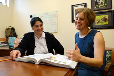 Mary Beth Manjerovic and Janice Friend discuss possible changes to the biology curriculum.