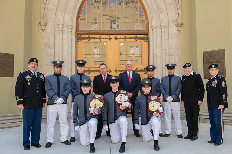The VMI club boxing team poses with their belts. 