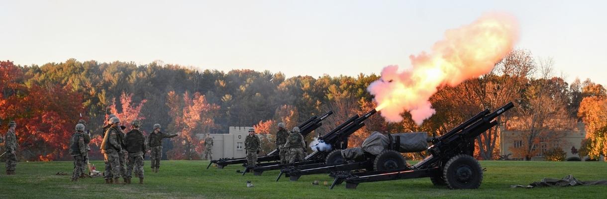 Members of the VMI Cadet Battery fire M2A1 (later M101A1) 105mm howitzers in preparation for Founders Day.—VMI Photo by Kelly Nye.