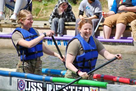 Cadets steer their concrete canoe named the U.S.S. Riester, named after Capt. Ned Riester, on Smith Mountain Lake.—VMI Photos by Col. Charles “Chuck” Newhouse