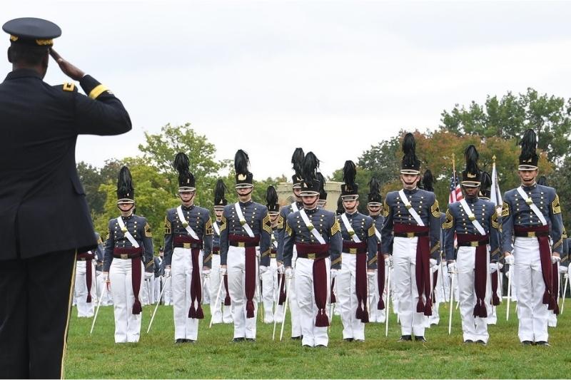 Maj. Gen. Cedric T. Wins ’85 salutes Robert Hoeft ’22, regimental executive officer, as Hoeft leads the Oct. 9 parade.—VMI Photo by H. Lockwood McLaughlin