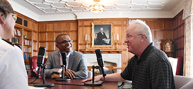 Dr. Wade Bell and Dr. Atin Basu begin their discussion in the Moody Hall library.